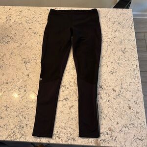 Black fleece lined running tights in medium tall.